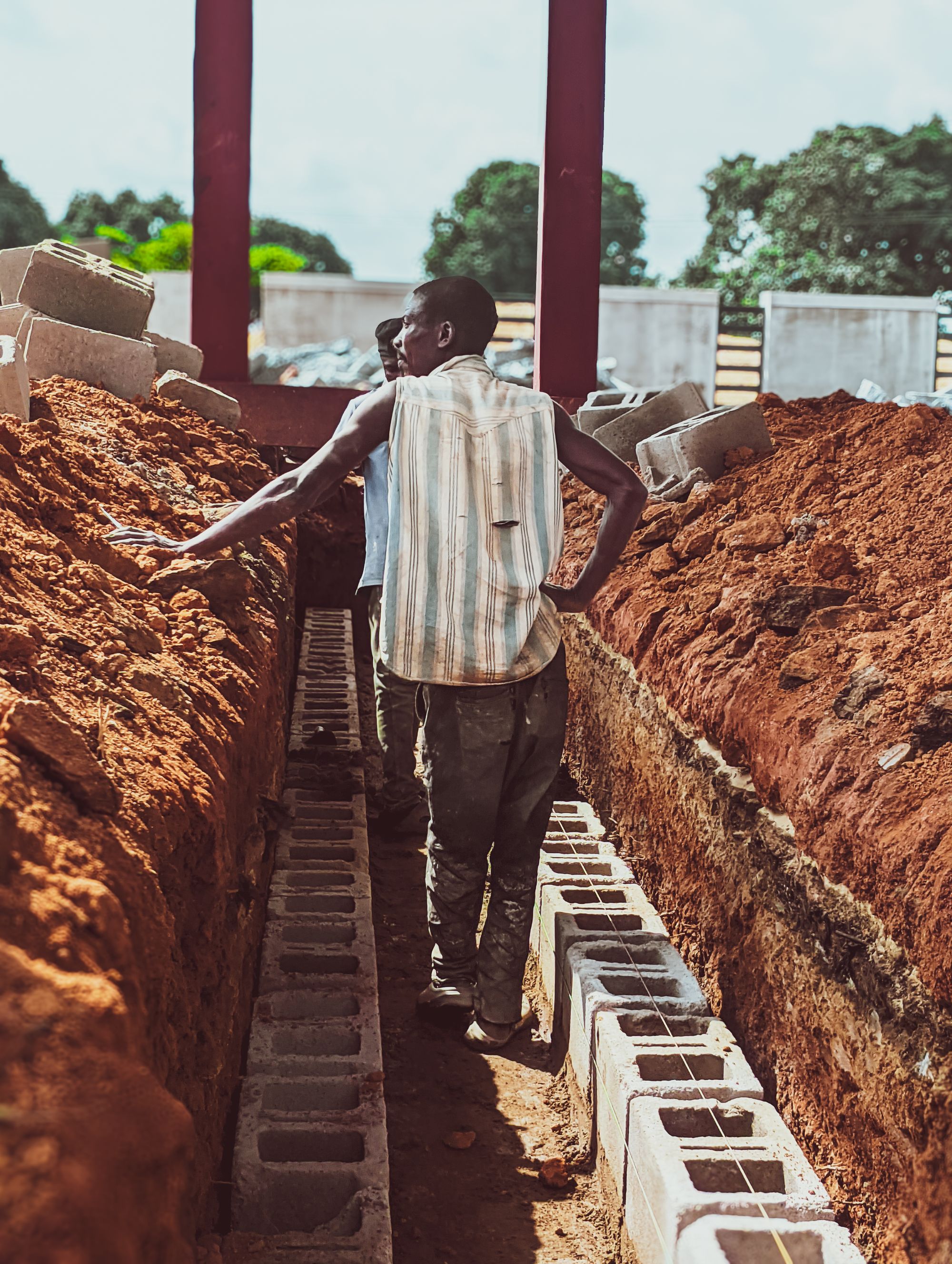 Workers laying foundation bricks in Kaduna, Nigeria