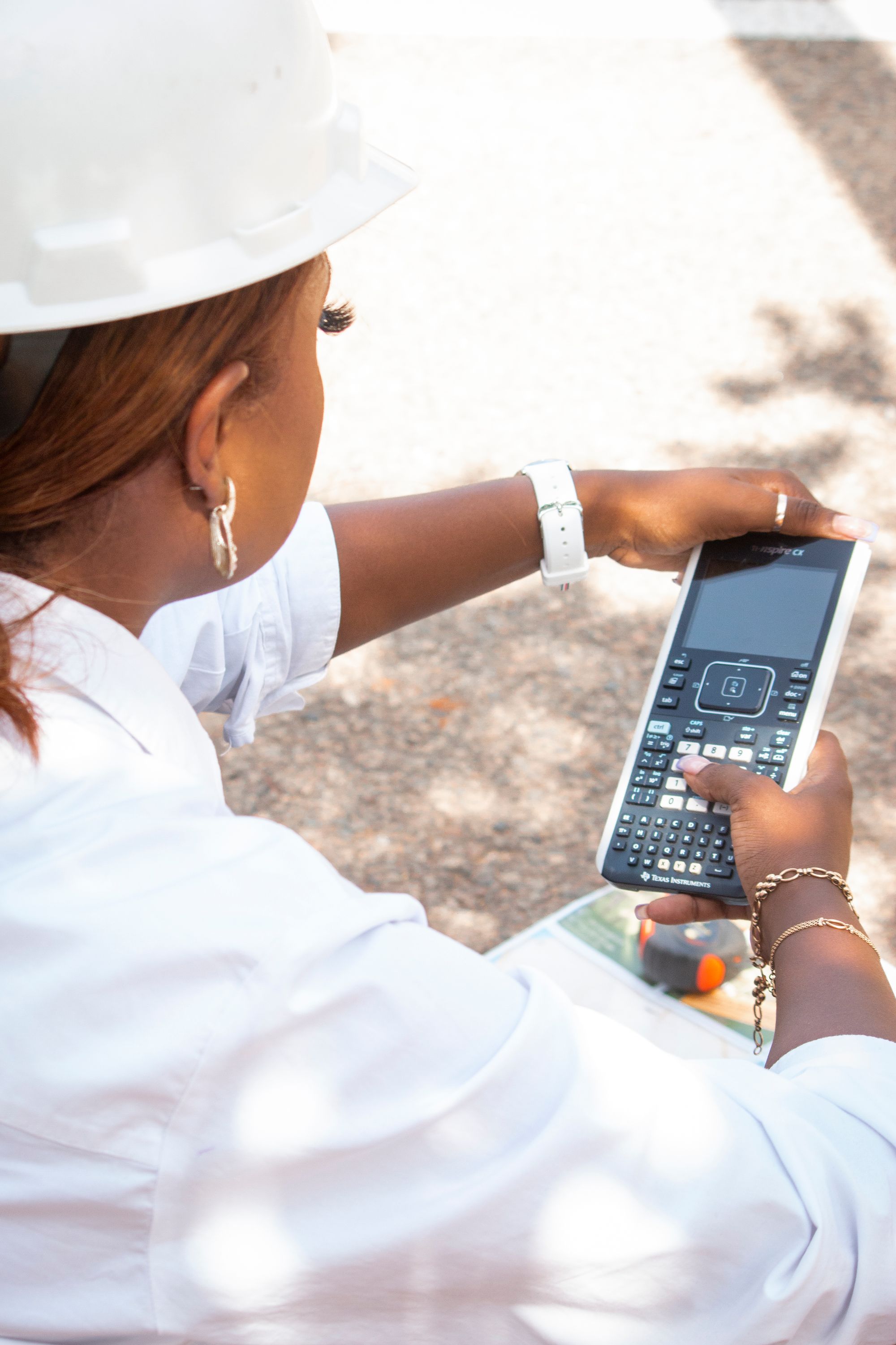 Engineer reviewing calculations on a construction site in Angola