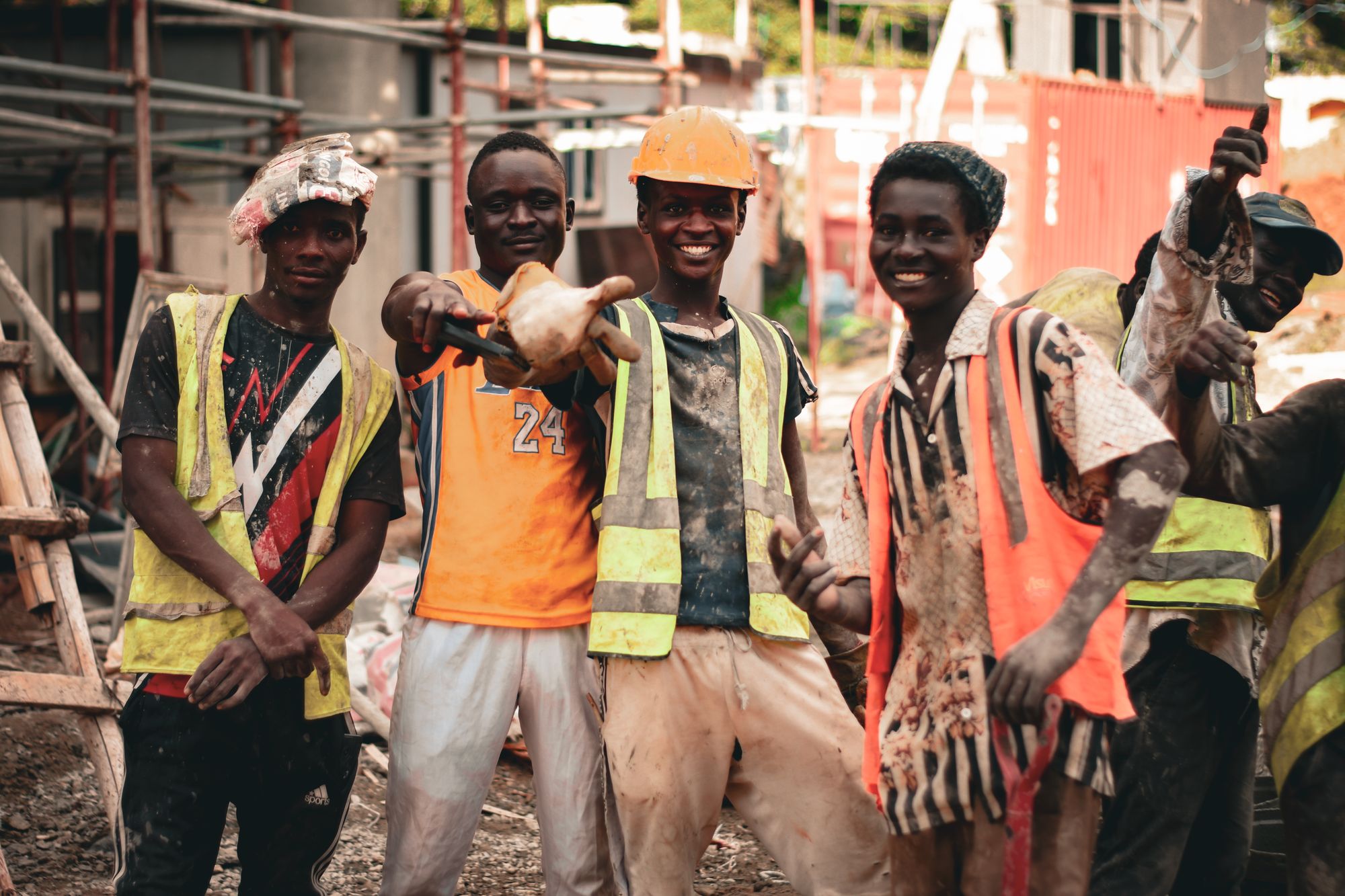 Construction team in safety vests and helmets on site